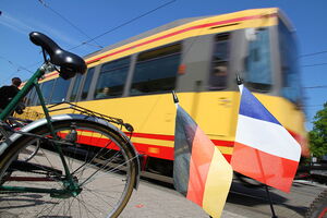 Tramway, two flags and a bicycle